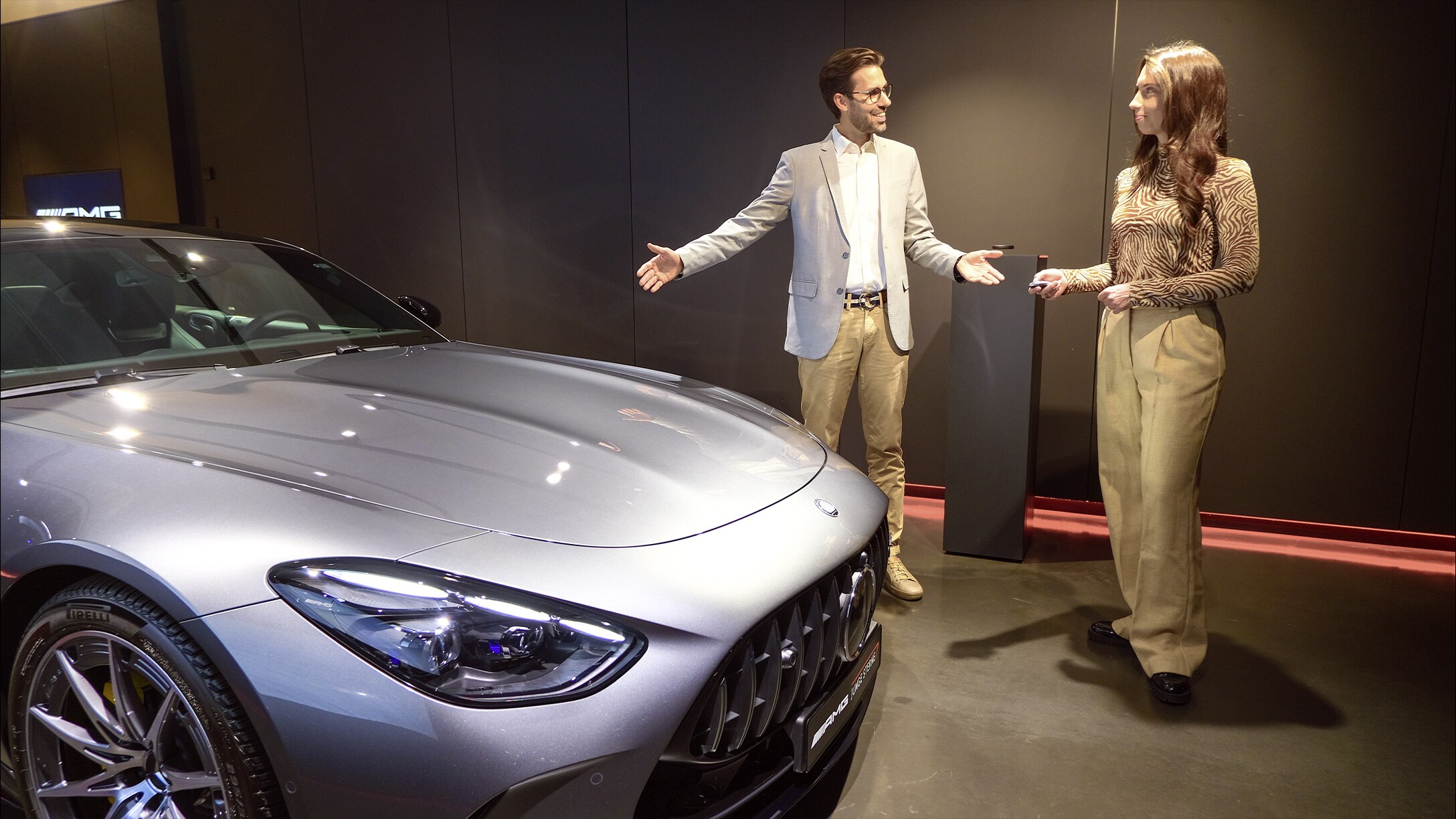 Handover of certified pre-owned vehicles from Mercedes-AMG in new car format.