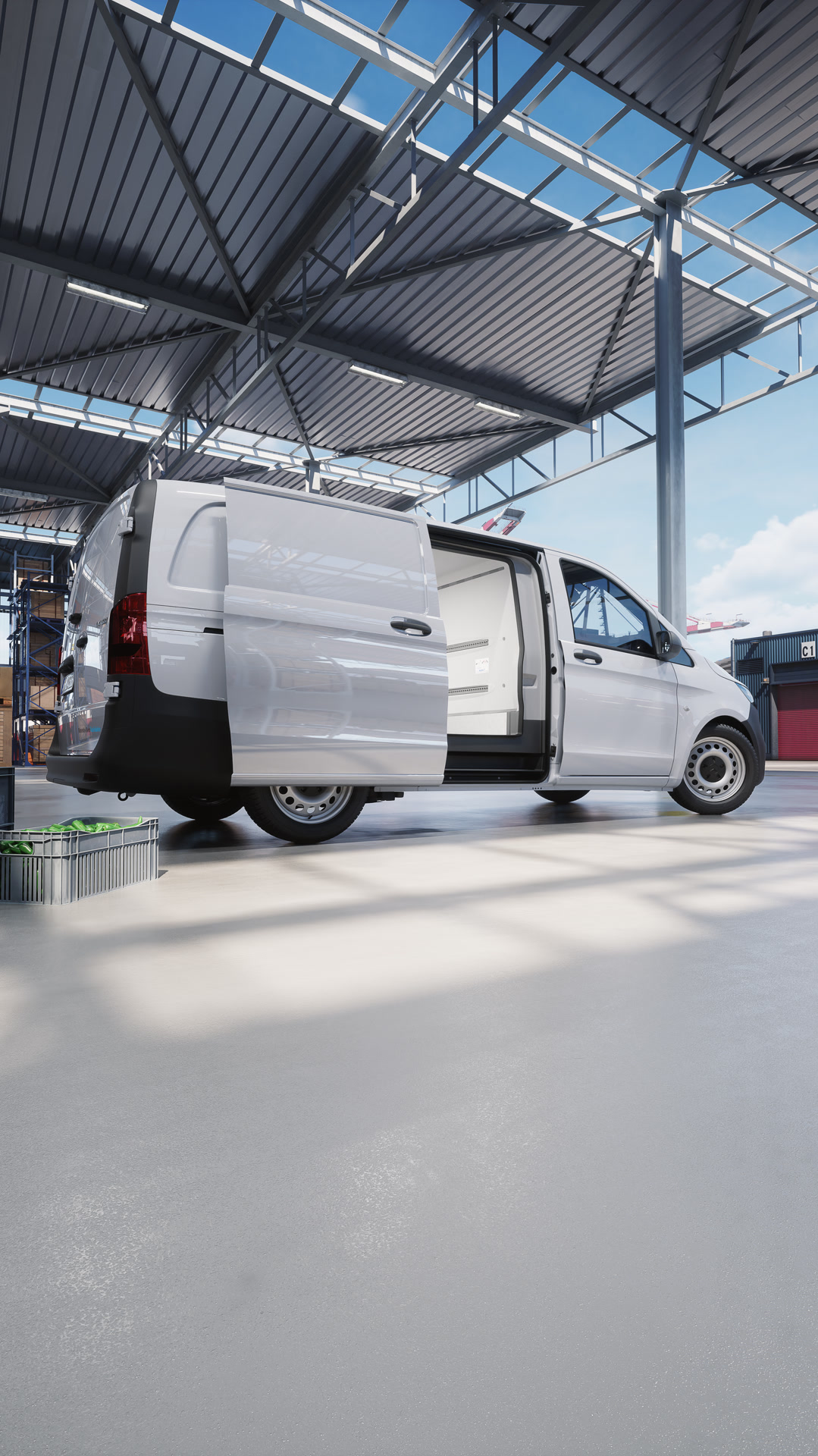 La Mercedes-Benz Vito à caisse frigorifique est stationnée dans une zone logistique et dispose d'une porte coulissante ouverte – elle est adaptée au transport de marchandises sous température contrôlée.