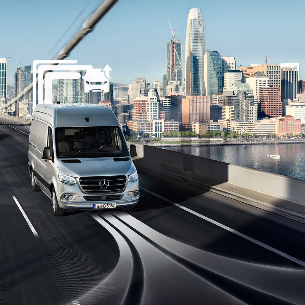 Van Uptime Monitor | Digital Extras | Mercedes-Benz A Mercedes-Benz Vans transporter drives across a multi-lane bridge at day.