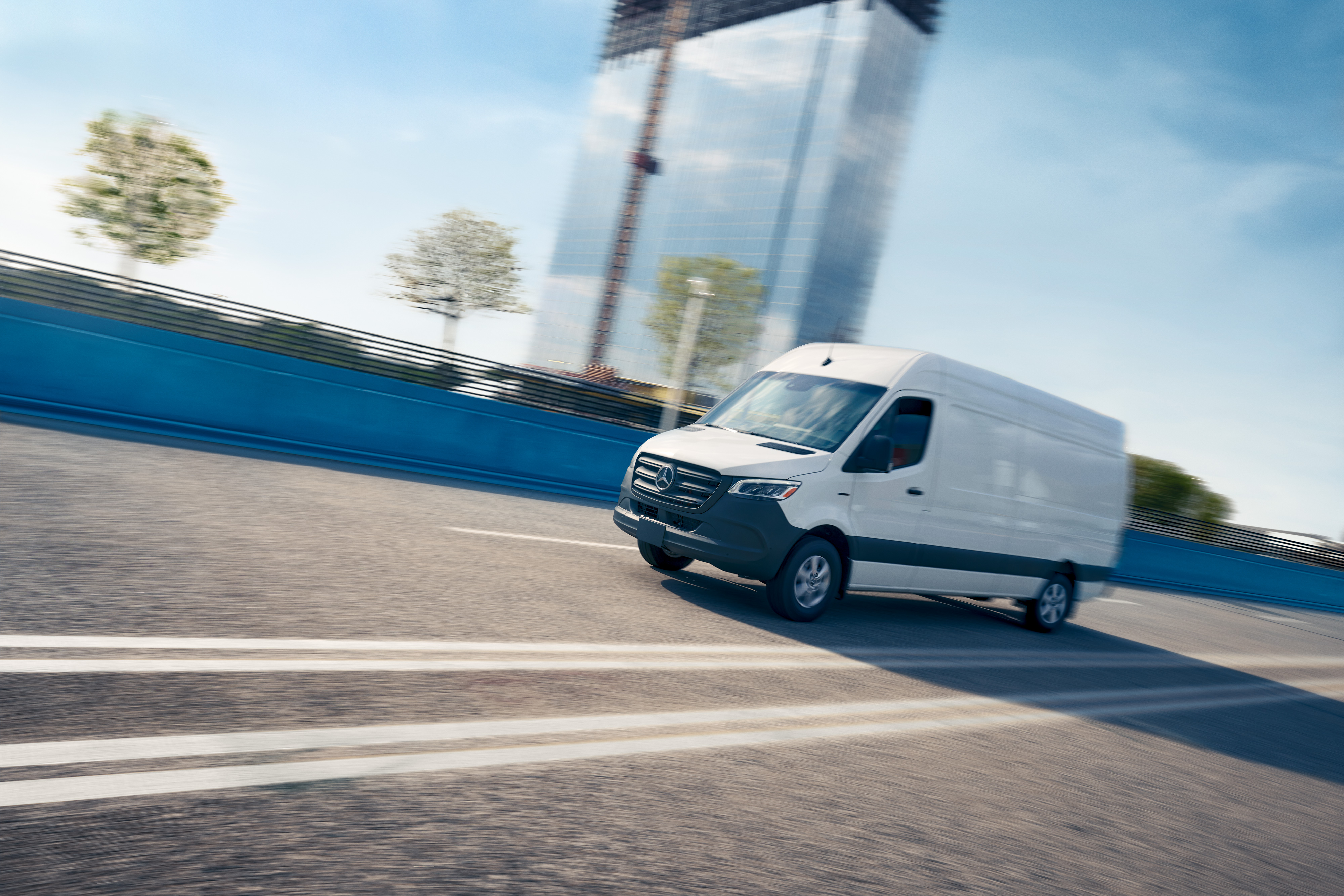 Mercedes-Benz | Van technology | OSA White van driving on a road, advertising for the Mercedes-Benz Service App with online appointment booking.