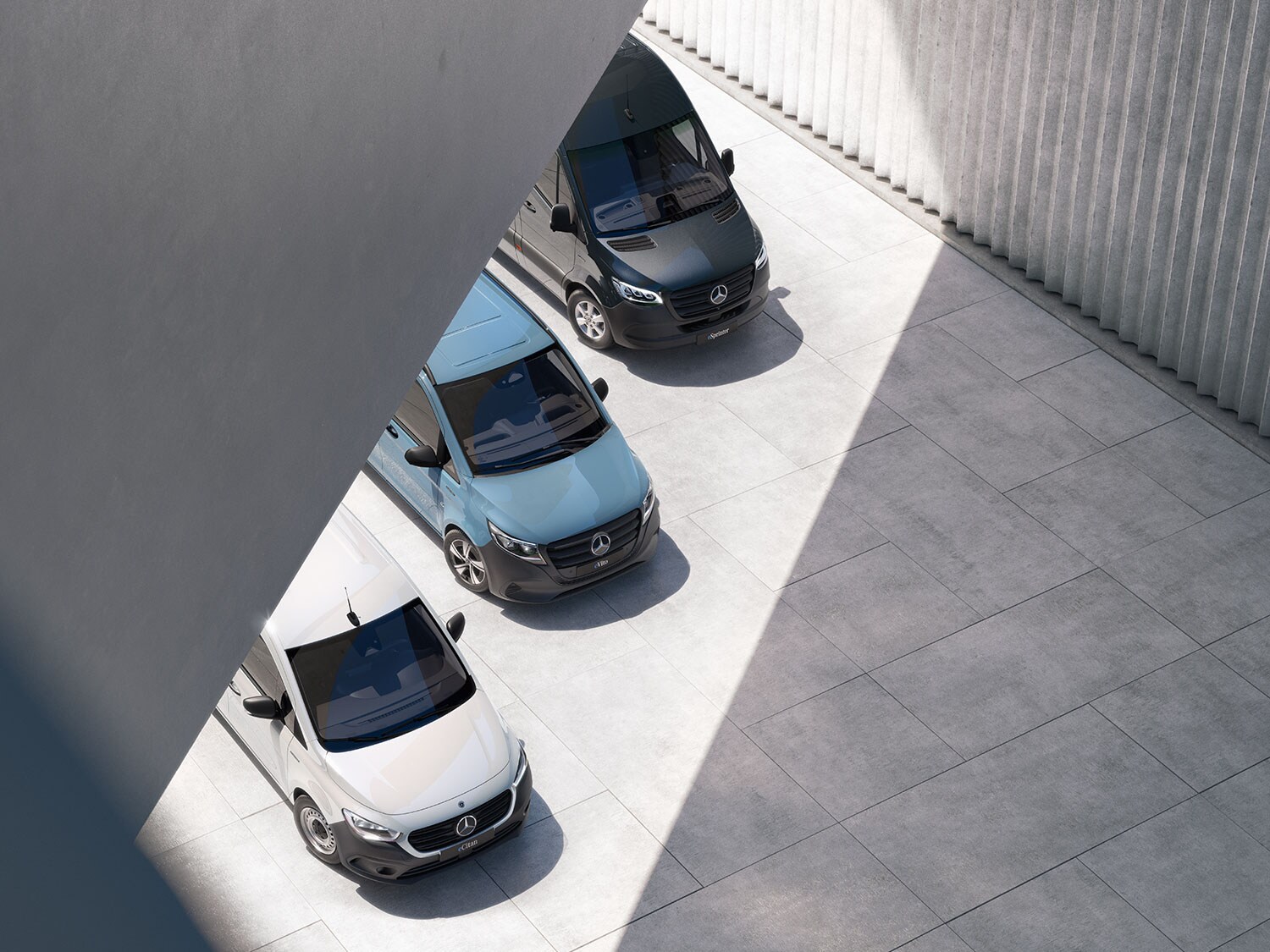 Trois fourgons Mercedes-Benz vus d'en haut.
