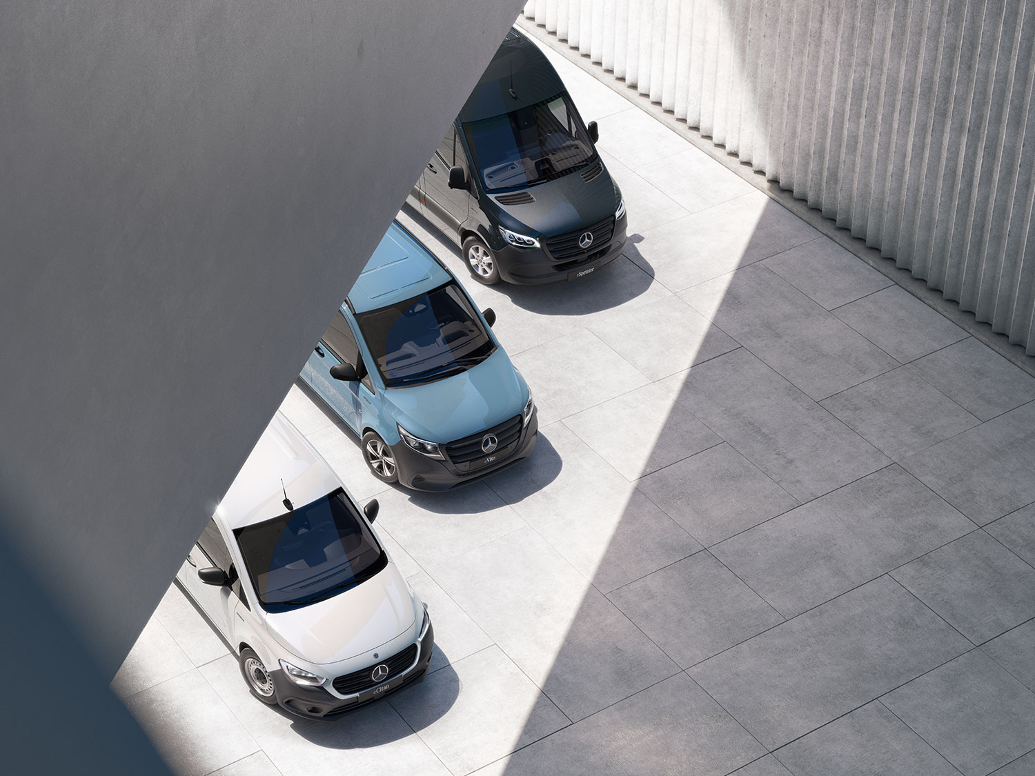 Véhicules utilitaires Mercedes-Benz Trois fourgons Mercedes-Benz vus d'en haut.
